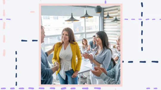 a group of people congratulating a woman on her promotion