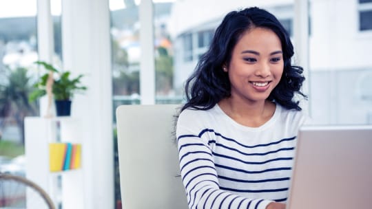 woman typing on a computer