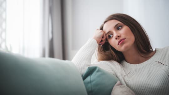 Woman thinking and looking sad