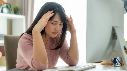 woman frustrated at desk