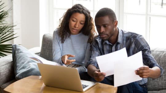 Couple looking at bills