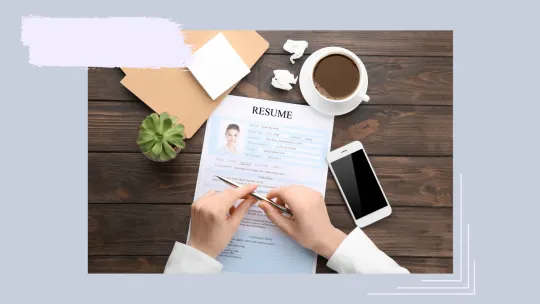 a person writing their resume