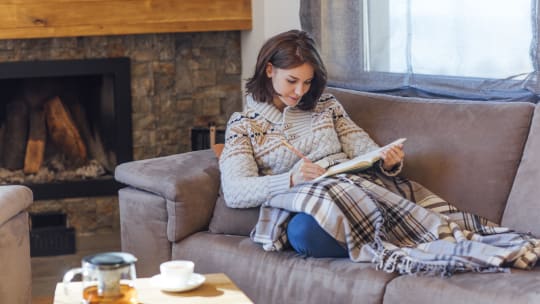 Woman writing down goals