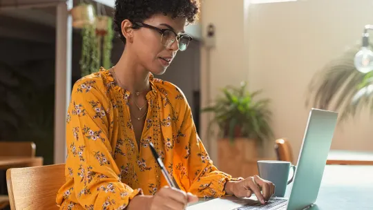 Woman typing on computer