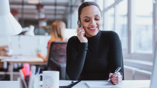 Woman at work speaking on the phone