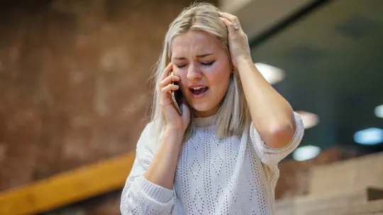 Woman with face in hands