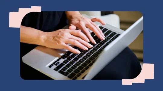 a woman typing on a computer