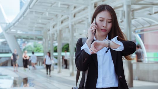 A woman looking at her watch