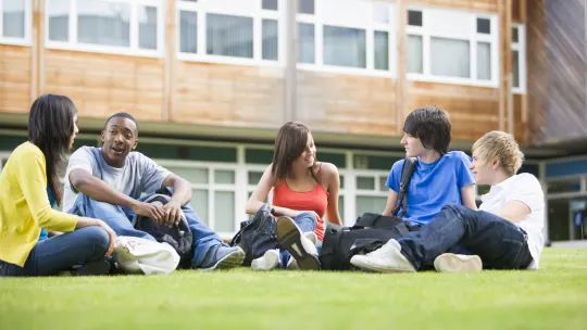 group of college students chatting on the quad