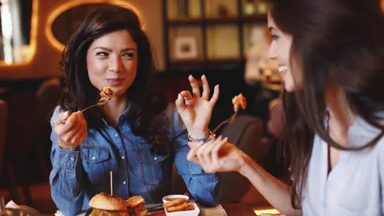 women eating at restaurant