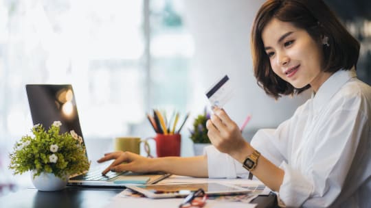 Young woman with credit card