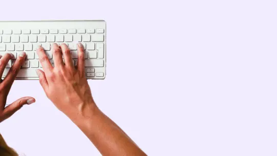 person typing on keyboard