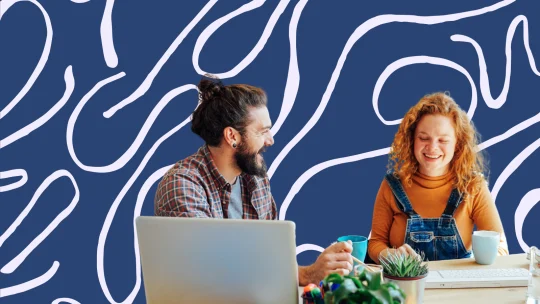 two people working and laughing