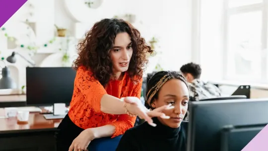 Coworkers in an office setting, illustrating the signs of a toxic boss