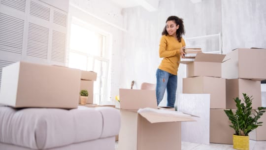 Student unpacking in dorm