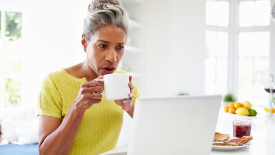Woman working and drinking coffee