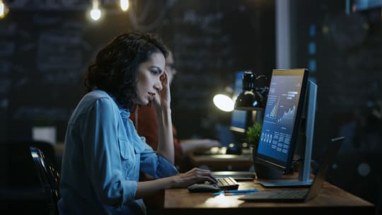 woman at a computer upset