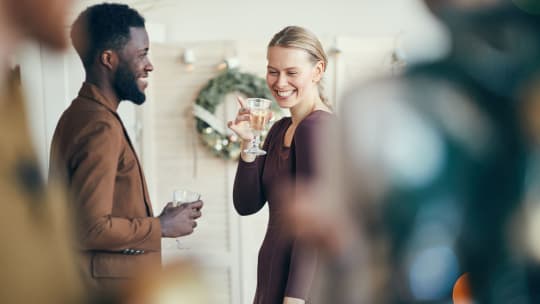 colleagues toasting at work holiday party