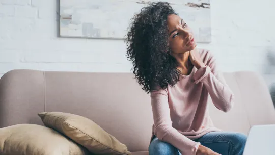 Sad woman on couch 