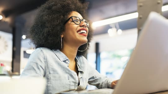 Happy woman on laptop