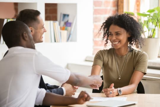 Professional woman shaking hands at work