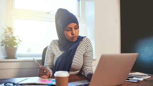 Woman typing on computer