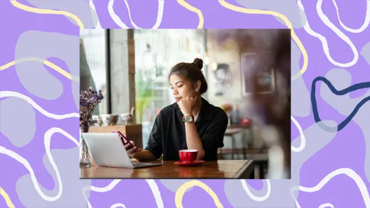 woman working and looking at phone