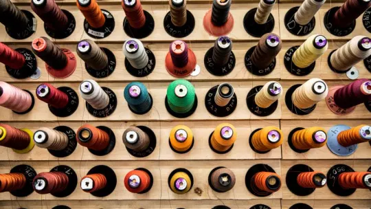 A picture showing multiple colors of thread.
