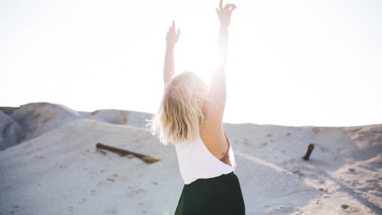 Woman with raised arms