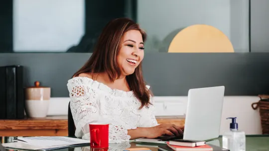 Woman typing on computer
