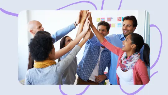 a group of people high fiving.