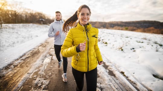 Woman jogging in snow