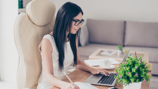 woman drafting financial feasibility study