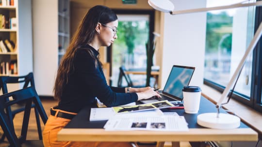 Woman typing on computer