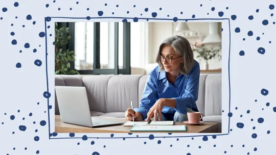 woman writing at desk