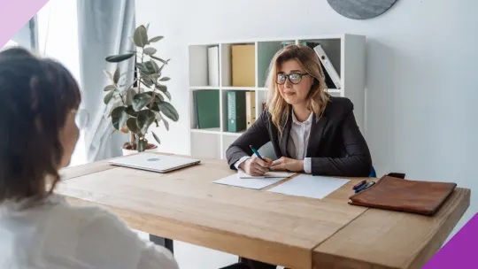 Hiring manager and candidate in an interview to illustrate that you should prepare a few questions to ask an interviewer to show that you care about the position.