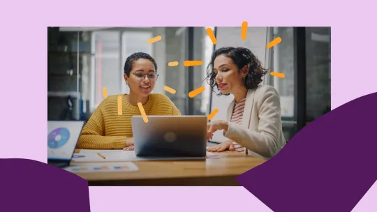 two women talking at work