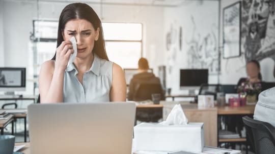 Upset woman on computer