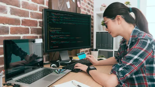 Web developer coding on a computer
