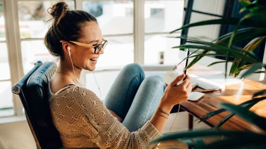 Woman with headphones at work