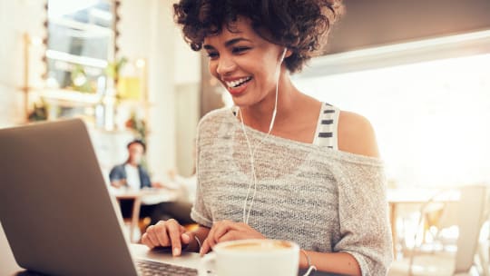 Professional on a computer smiling
