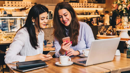 Two women working at a cafe