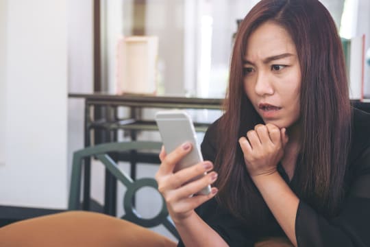 Stressed woman with phone