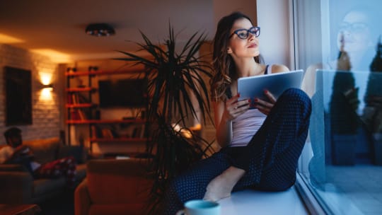 Woman reading on couch