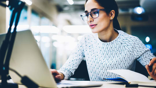 Woman Typing on Computer