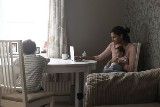 Mom working from home with baby