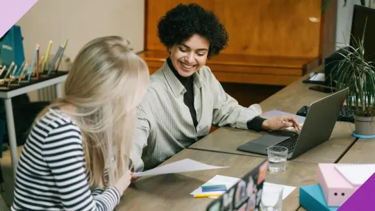 Coworkers in an office setting, illustrating the importance of small gestures at work