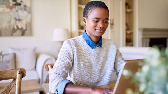 Happy woman on laptop