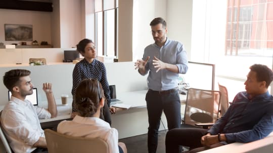 male boss leading a meeting