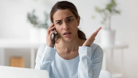 Frustrated woman on the phone